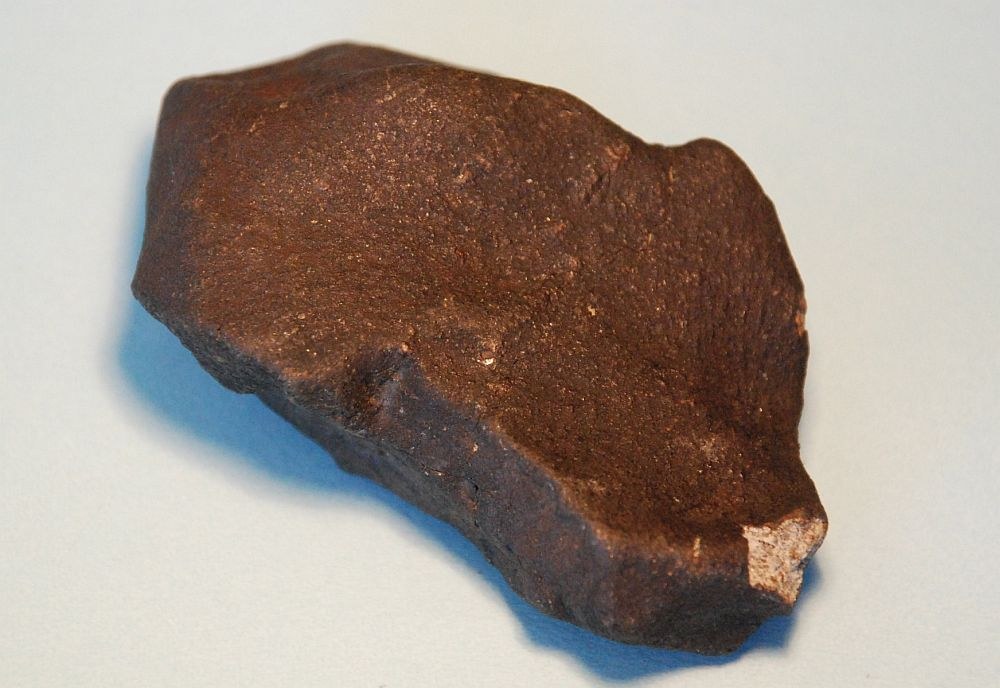 Iron meteorites will look like rusty lumps of iron, and unlikely to be found in humid or wet areas , as they rust away fairly quickly