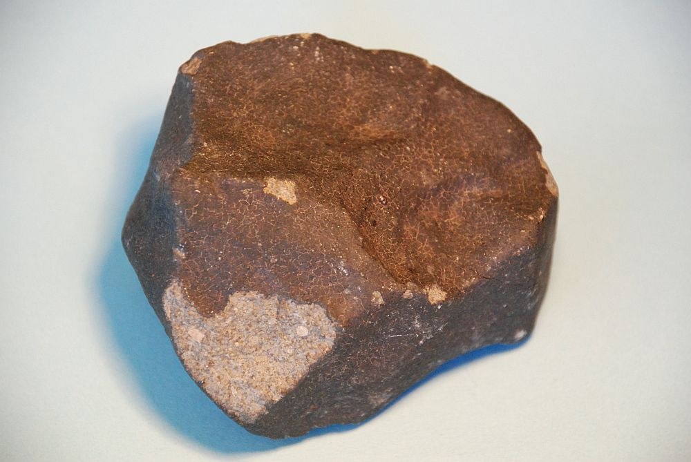 Iron meteorites will look like rusty lumps of iron, and unlikely to be found in humid or wet areas , as they rust away fairly quickly